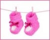 9999369-pink-baby-booties-blue-isolated-on-white.jpg
